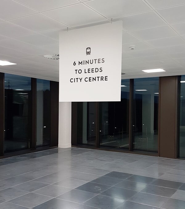 Train Station Hanging Signage